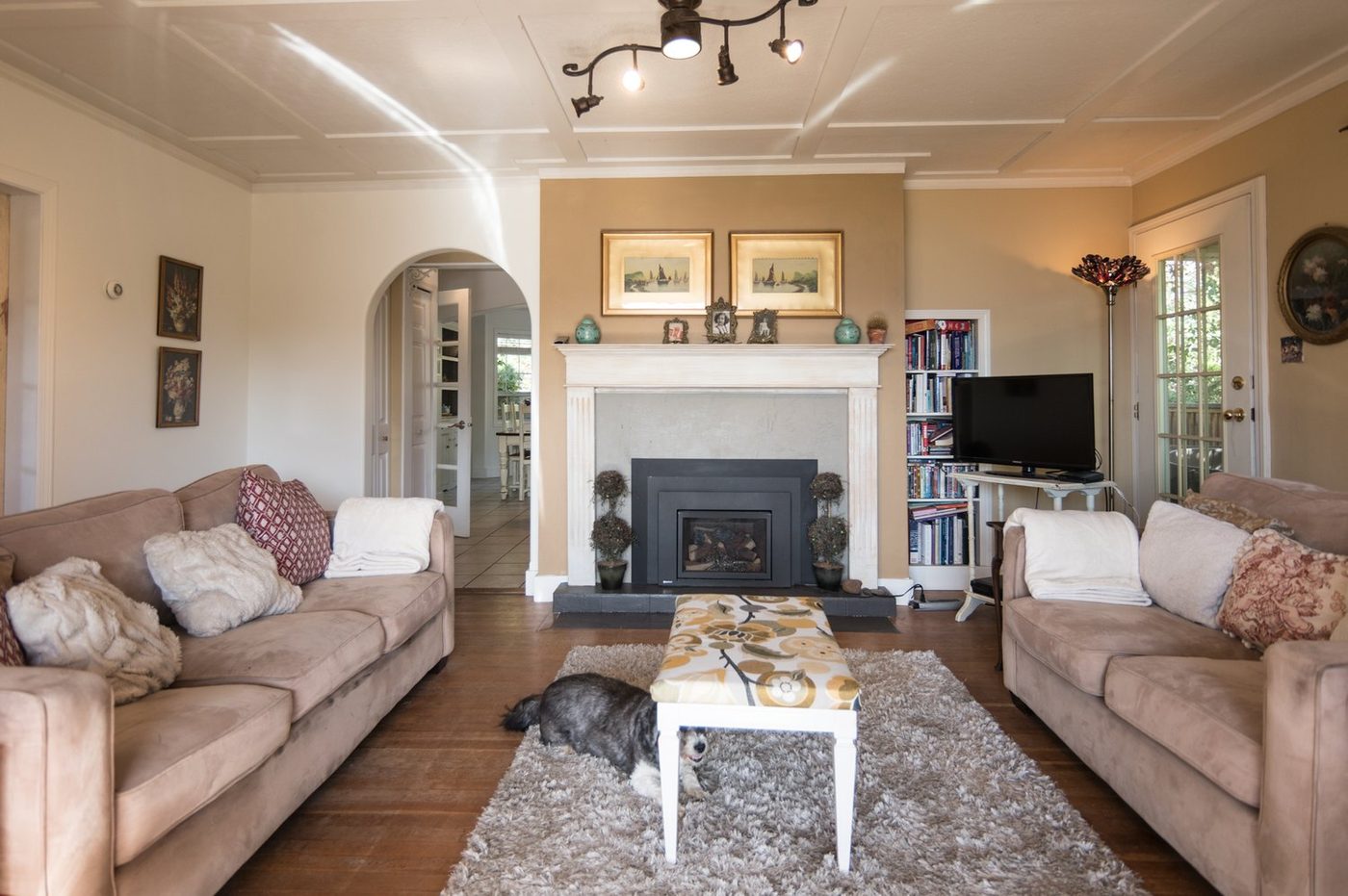 The guest living room, with a fireplace and deep sofas