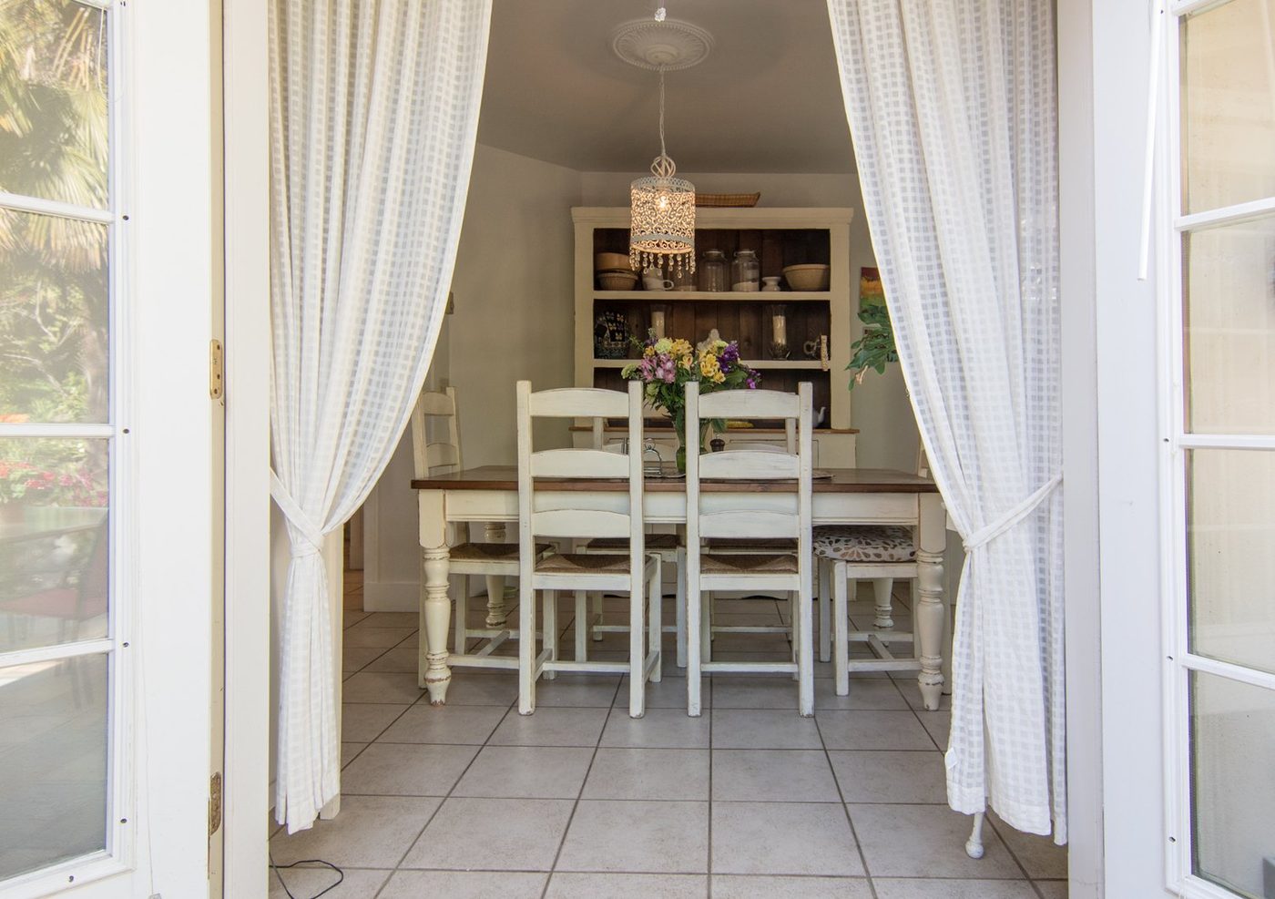 The dining room seen through open French doors